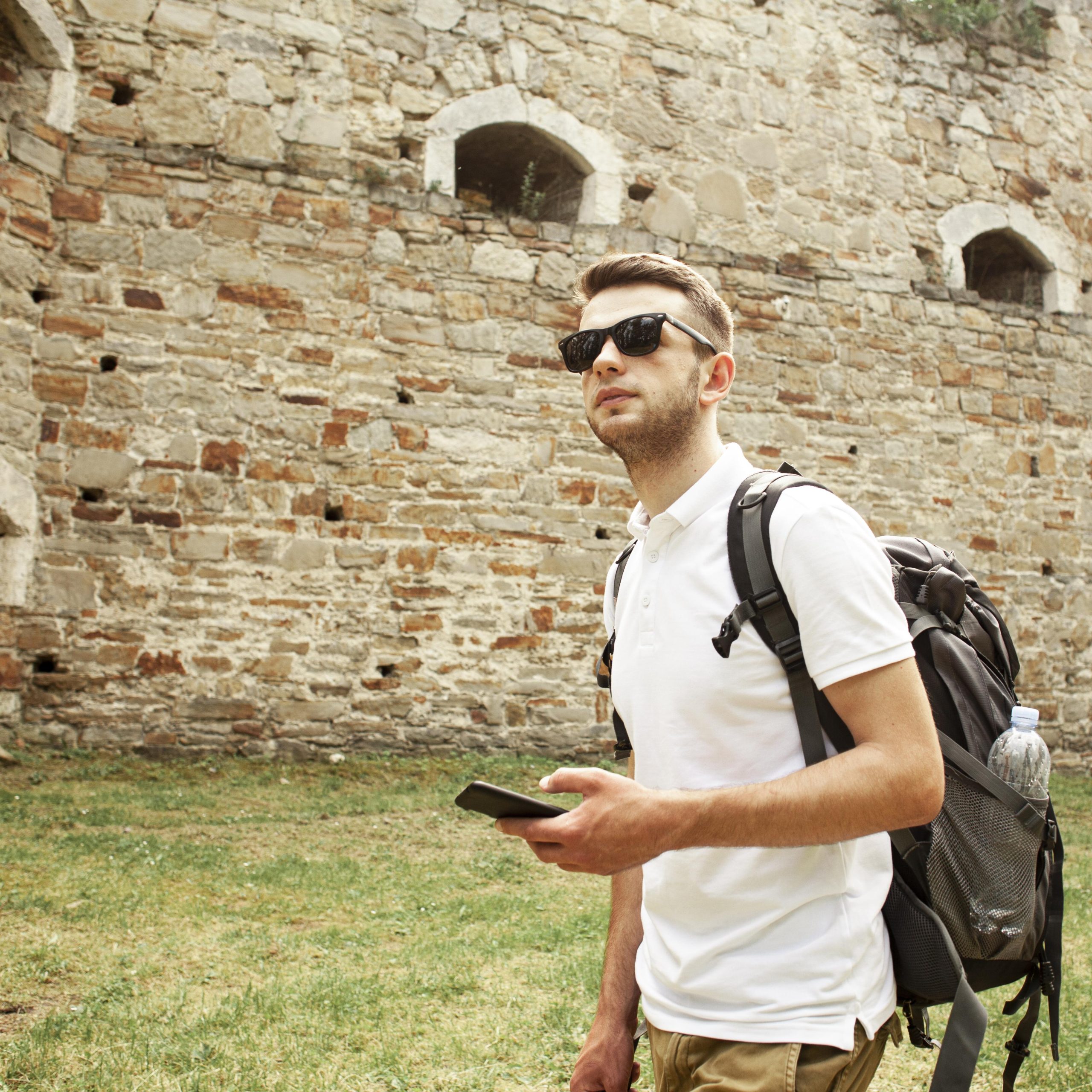 man-with-sunglasses-castle-ruins