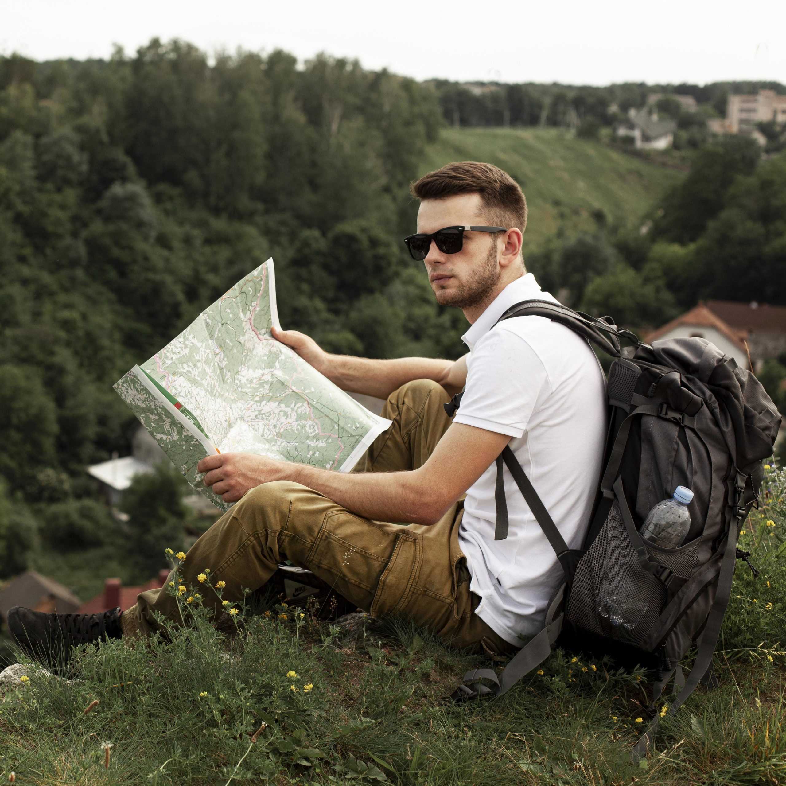 young-man-traveling-alone-reading-map